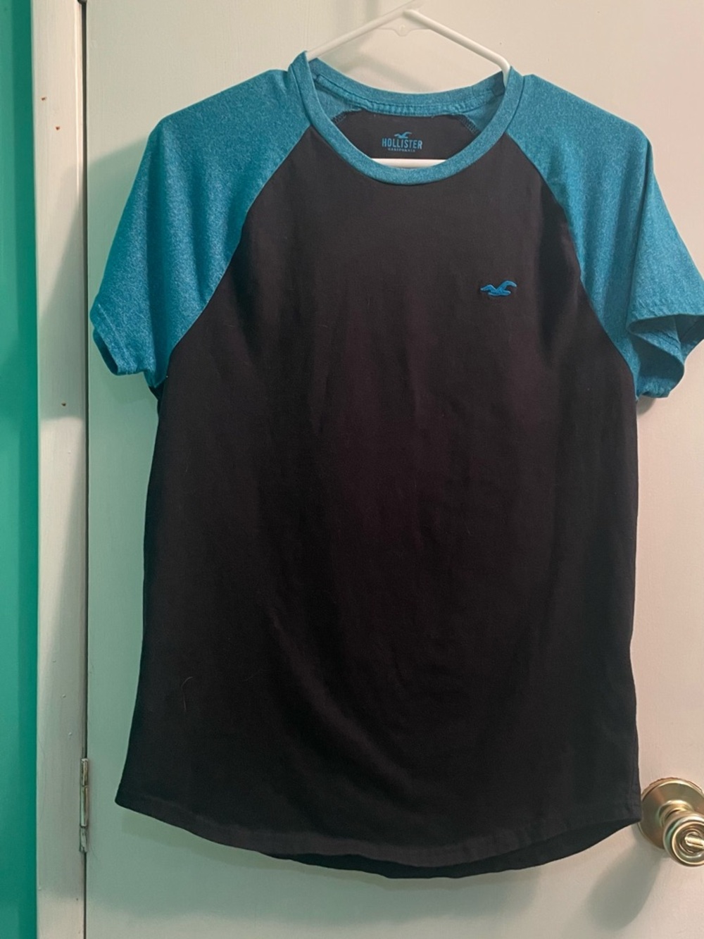 Hollister Black Tee with Teal Raglan Sleeves
